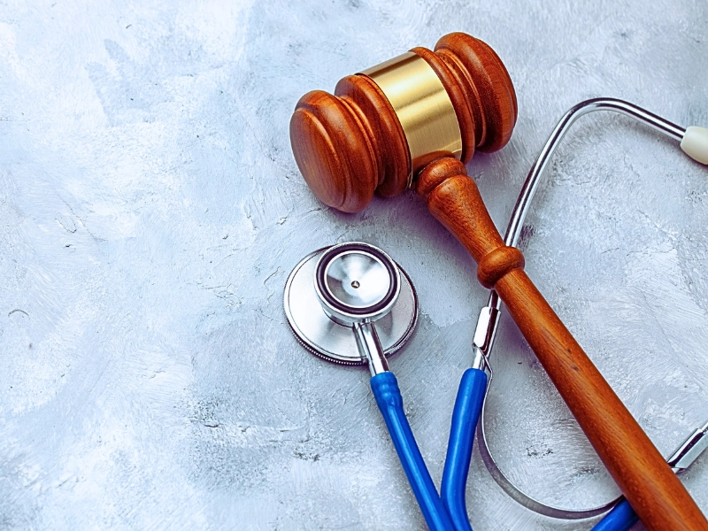 Judge gavel and stethoscope. The law in medicine, the sentence on medical negligence.