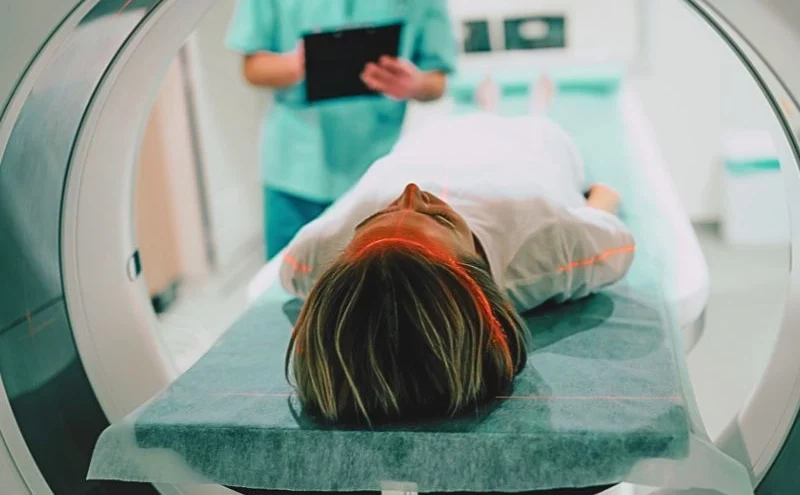 Injuries Caused by Ozempic 1 Young woman patient is ready to do magnetic resonance imaging in the modern hospital laboratory.