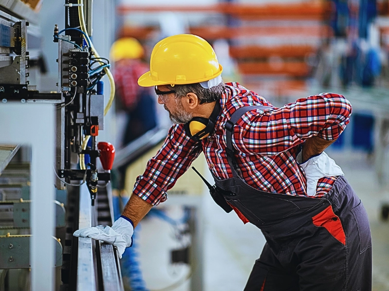 Factory worker with painful back.