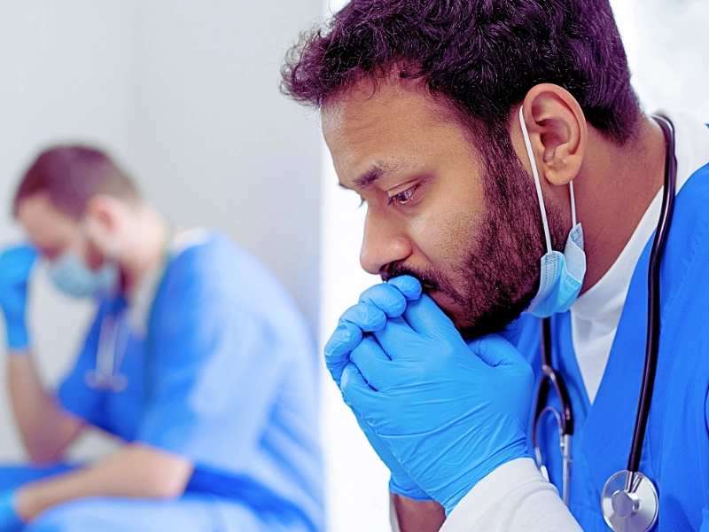 Doctors looking tired and sad. Can medical malpractice claims be settled out of court