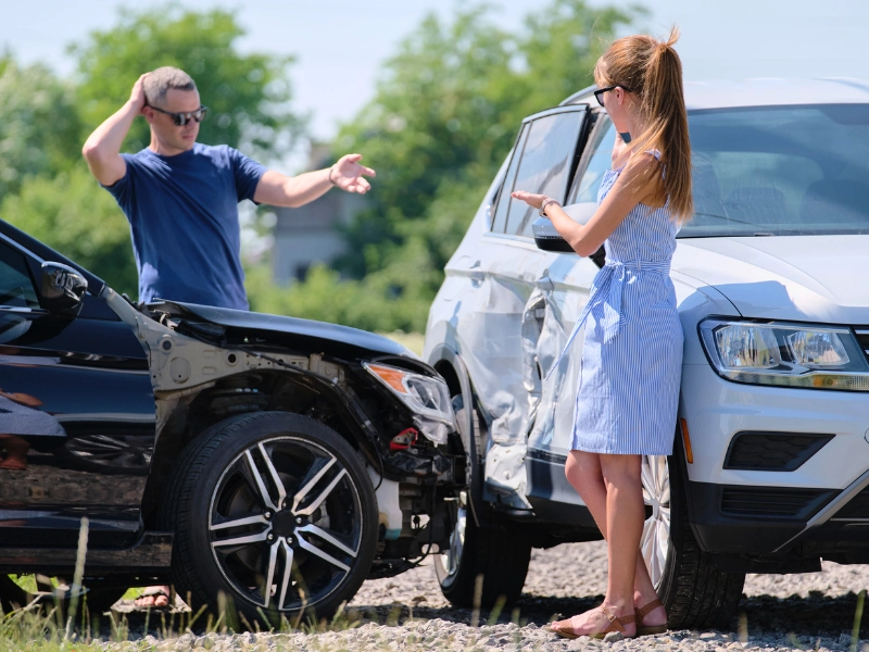 Two drivers having argument over who is guilty in car crash accident. Comparative negligence