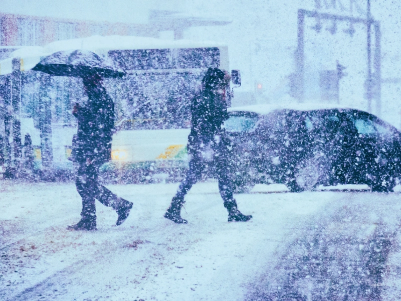 Pedestrians and traffic on a winter day. leading causes of unsafe driving