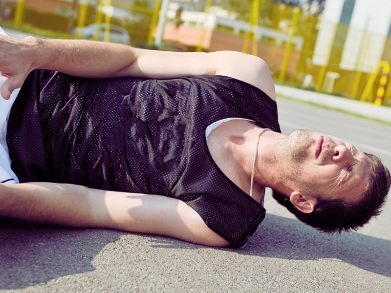 Basketball player have foot trauma stretch and injury at outdoor street ball court. slip and fall tips