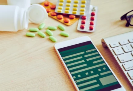 Smartphone and tablets on table. medication errors and pharmacy mistakes