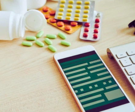 Smartphone and tablets on table. medication errors and pharmacy mistakes