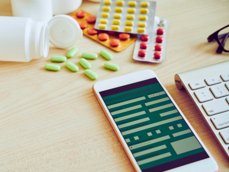 Smartphone and tablets on table. medication errors and pharmacy mistakes