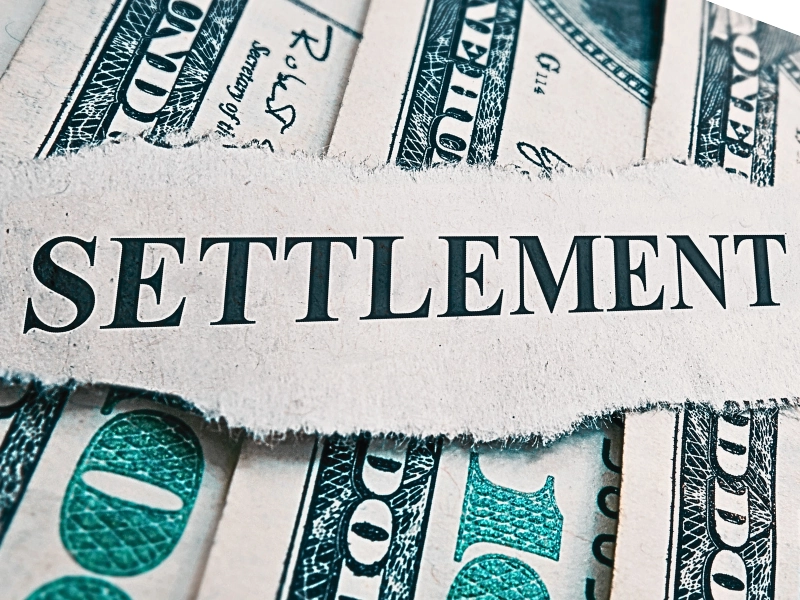 Settlement newspaper headline on money. Quick Settlement Offer