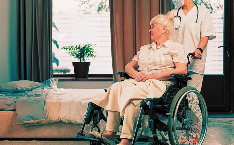 Can You Sue for a Loved One's Bedsores? Understanding Nursing Home Neglect in Illinois 1 Nurse assisting an elder woman on a wheelchair in her bedroom. Sue for a Loved One's Bedsores