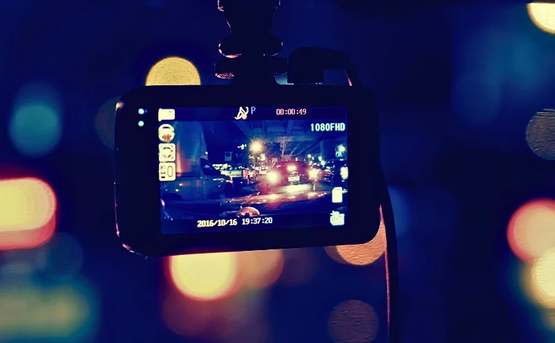 How Dashcam Footage Can Help (or Hurt) Your Naperville Car Accident Case 1 recorder camera on car - vintage effect filter. dashcam footage
