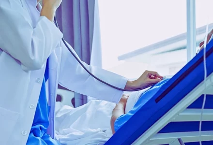 Female doctor listening to the patient's breathing using her stethoscope. delayed diagnosis could cost you