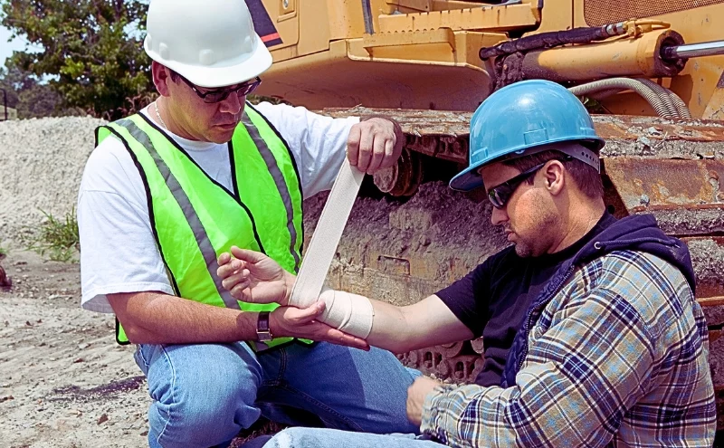 Third-Party Liability: When Someone Other Than Your Employer Is Responsible for Your Work Injury 1 Construction worker wrapping a fellow co-workers arm. third-party liability