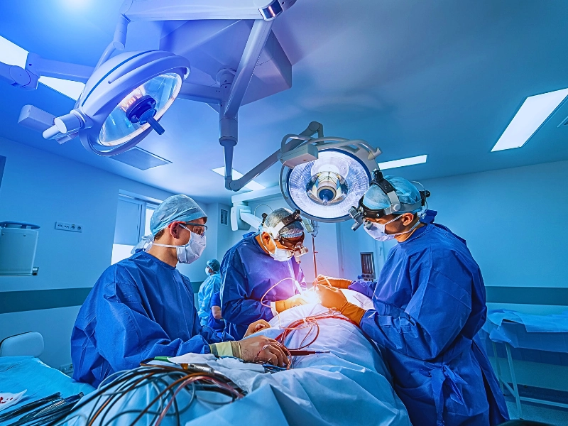 Neurourgeons are operating with medical robotic surgery machine.