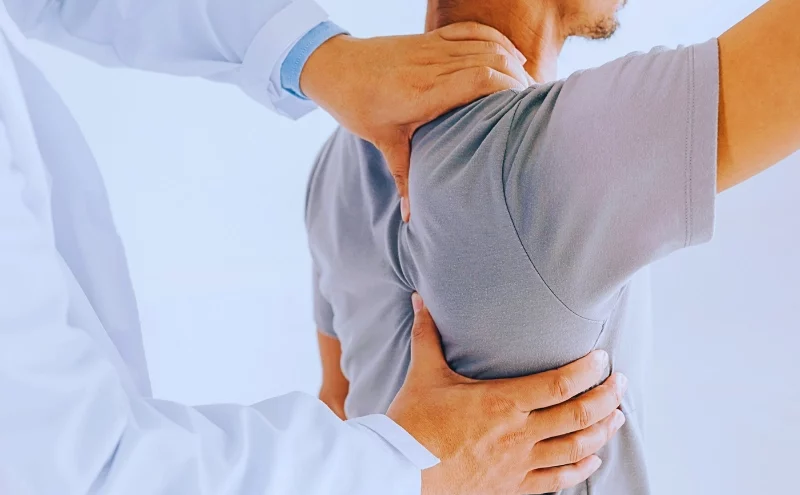 What Illinois Workers Need to Know About Independent Medical Exams 1 Physiotherapist doing healing treatment on man's back. Independent Medical Exams