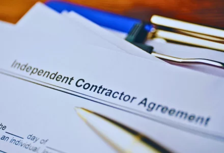 Legal document Independent Contractor Agreement on paper close up. Misclassify You as an Independent Contractor