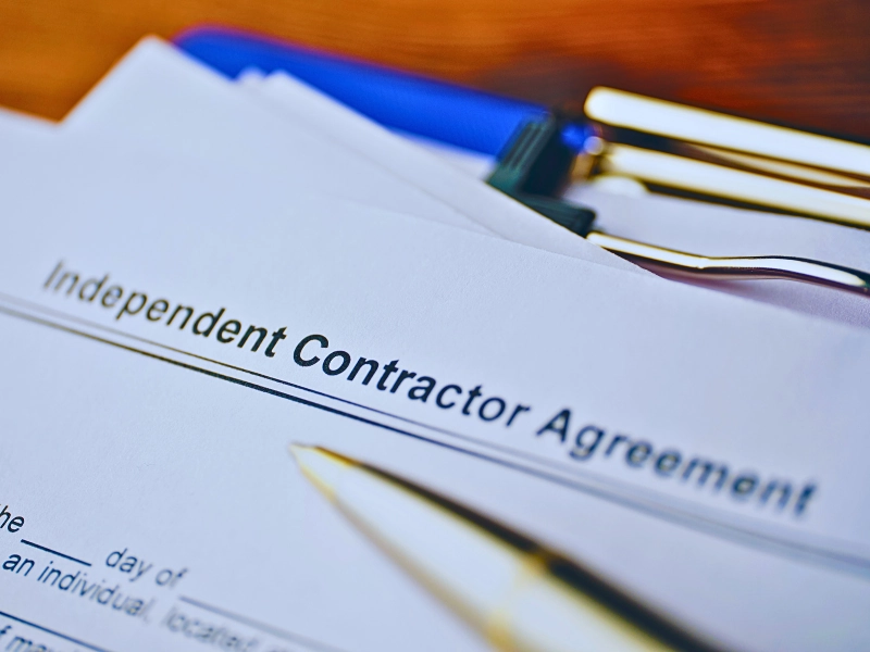 Legal document Independent Contractor Agreement on paper close up. Misclassify You as an Independent Contractor