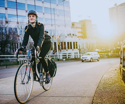 A person riding a bicycle on a city sidewalk. Blocked Bike Lanes
