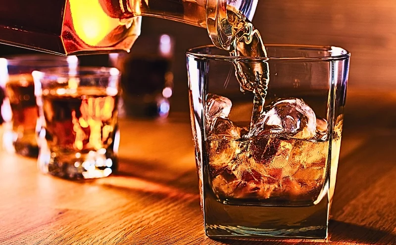 Dram Shop Claims After a DUI Crash in Naperville: Holding Bars and Restaurants Accountable 1 Whiskey and natural ice on old wooden table. Dram Shop Claims After a DUI Crash