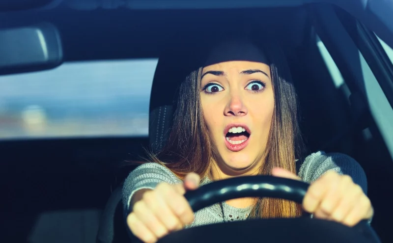 Can Parents Be Held Responsible for a Teen Driver’s Car Accident in Illinois? 1 Terrified woman clutching steering wheel while driving a car. Responsible for a Teen Driver’s Car Accident