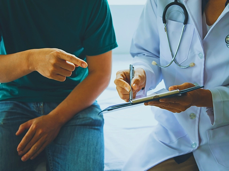 A doctor showing the medical report to her patient. Your Own Doctor for a Workers’ Comp Claim