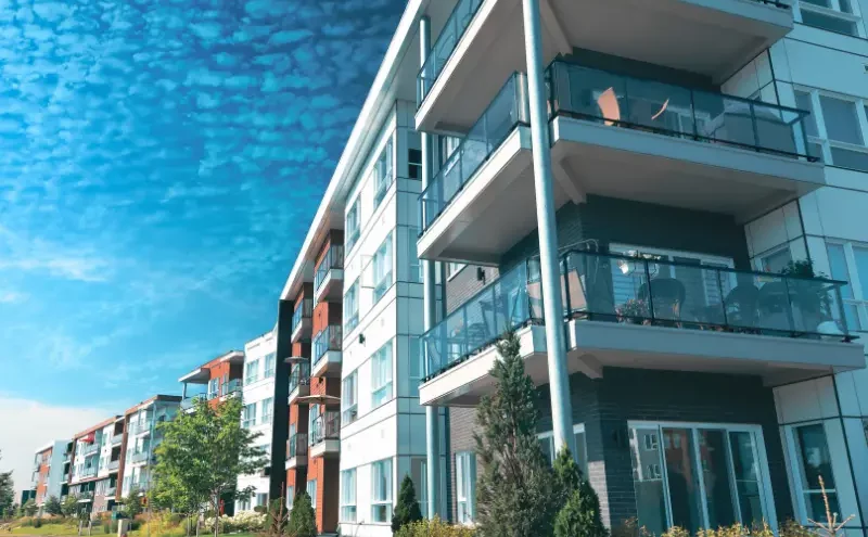 Modern apartment building with balconies under a blue sky. injury at an Illinois apartment complex