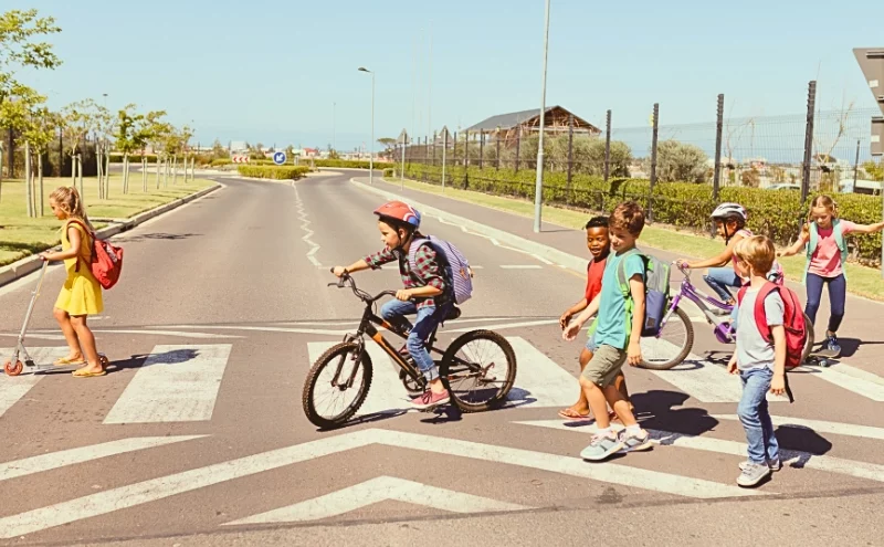Franklin Park E-Bike Accident: Understanding Intersection Safety Risks in Chicago Suburbs 1 Group of school children crossing the street at a crosswalk.